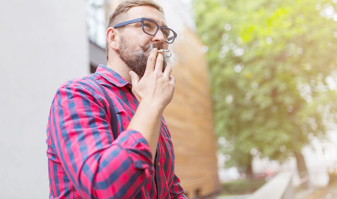 Man Smoking A Weed Hub Joint