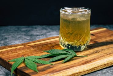 Cannabis Ice Tea on a Wooden Cutting Board